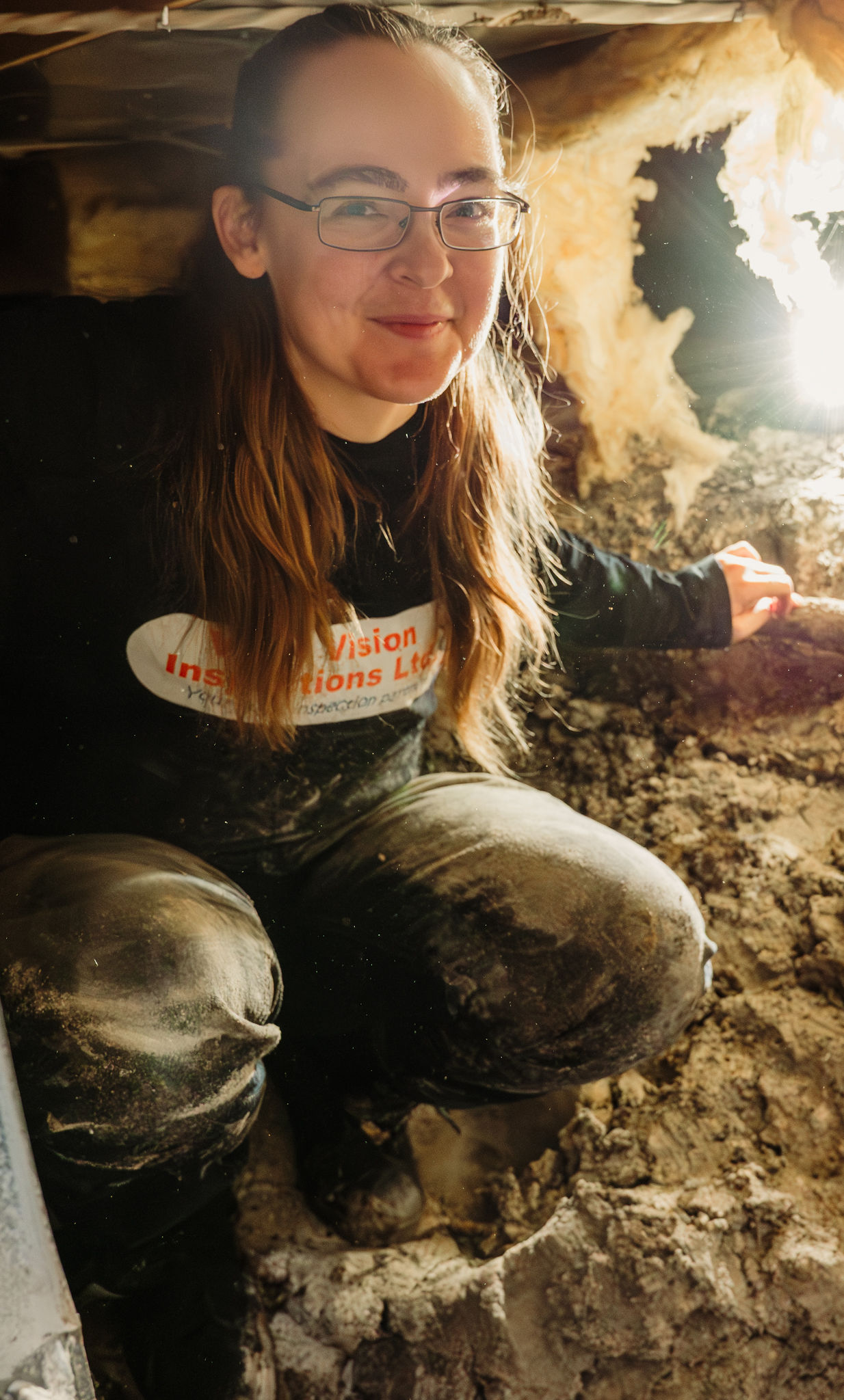 Showing home inspector Tara in a crawl space inspection