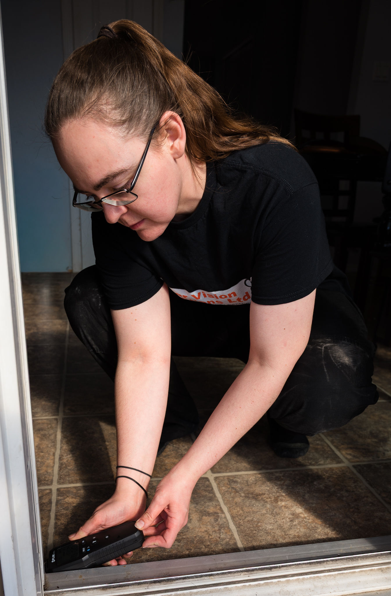 Home inspector testing for moist spots